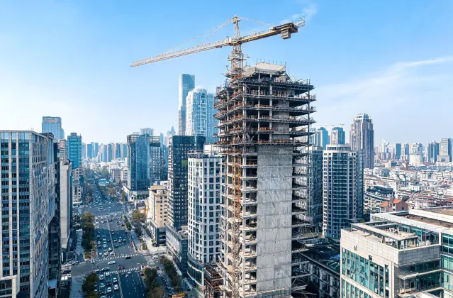 Downtown high-rise tower crane climb